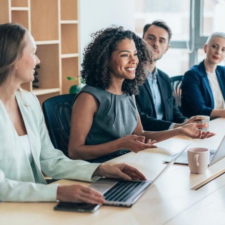 team on people in a business conference listening to the woman speaking