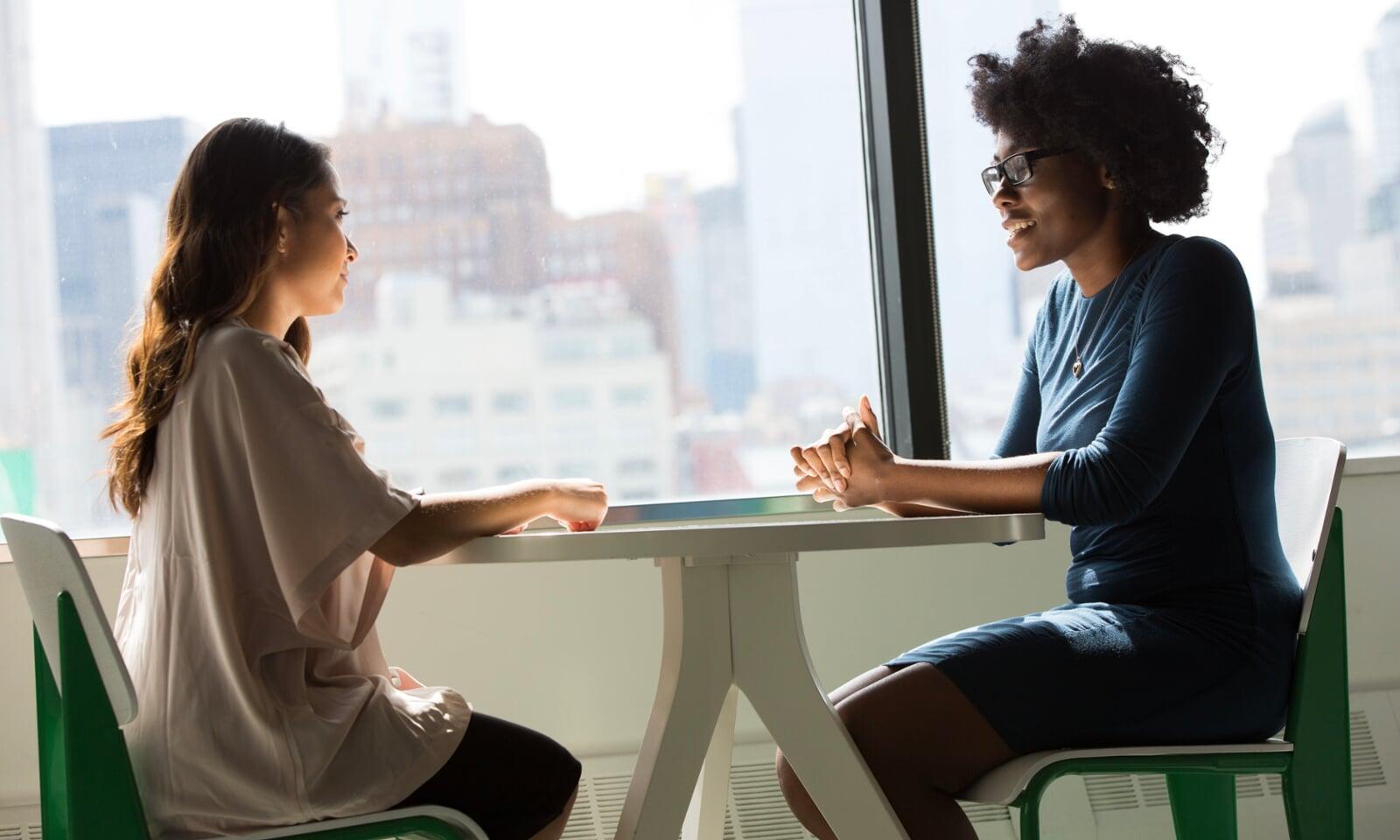 initimate close discussion two women professional business